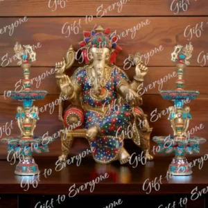 Brass Ganesha seated on a throne